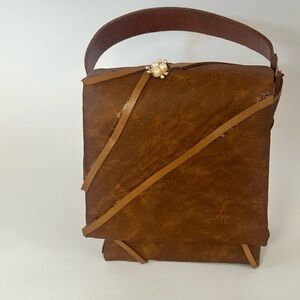 Women’s Brown Leather Messenger Bag with Decorative Strap Accent